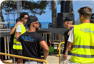 Drone pilots taking aerial photos of a commercial building