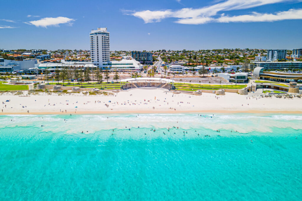 Beautiful view of Scarborough Beach, featuring golden sands, clear waters, and a lively coastal atmosphere