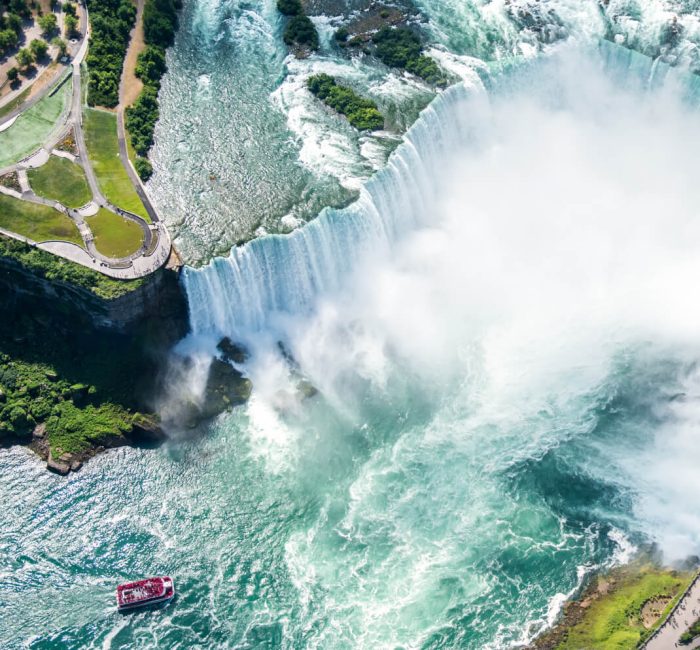 Niagara waterfall (1) (2) "Majestic view of Niagara Falls with cascading water and mist."