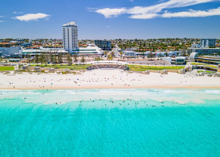 Beautiful view of Scarborough Beach, featuring golden sands, clear waters, and a lively coastal atmosphere
