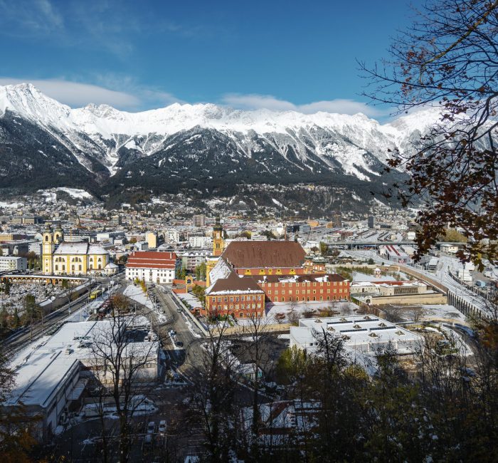 Aerial view of Innsbruck with Wilten Abbey and Alps mountains – Aerial view of Innsbruck with Wilten Abbey and Alps mountains - Innsbruck, Tyrol, Austria