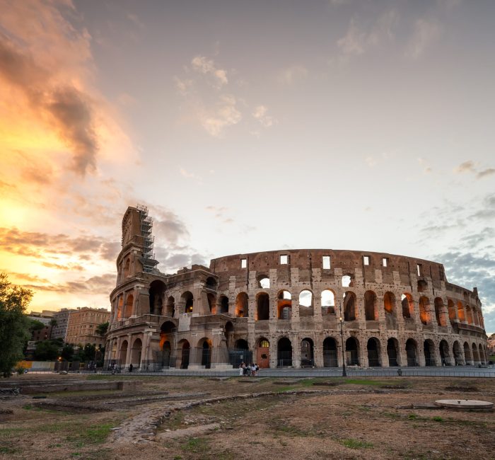 Amazing view of the Colosseum at beautiful warm light at sunrise, Rome, Italy. Amazing view of the Colosseum at beautiful warm light at sunrise, Rome, Italy.