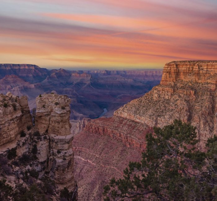 Dramatic Grand Canyon sunset A view of the rugged yet beautiful and dramatic Grand Canyon national park during a moody sunset shows the intricate details of the ridges and formations.