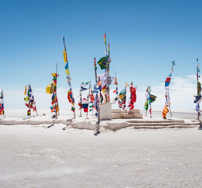 International flags at the Dakar monument on the Salar de Uyuni salt flats in Bolivia International flags at the Dakar monument on the Salar de Uyuni salt flats in Bolivia