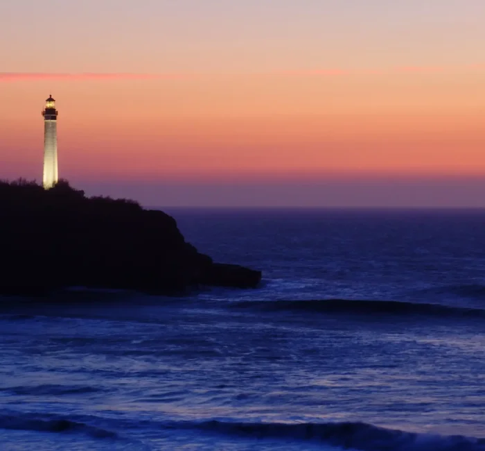 lighthouse-by-sea-against-sky-sunset lighthouse-by-sea-against-sky-sunset