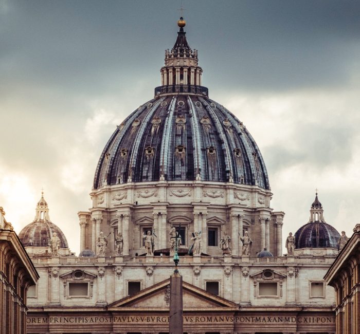 St. Peter’s Basilica Dome in Vatican City St. Peter's Basilica dome in Vatican City with dramatic clouds, showcasing Renaissance architecture.