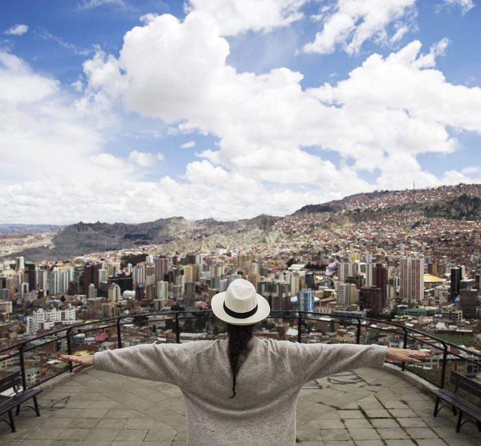 Young woman in La Paz, Bolivia Young woman looking at the panorama of La Paz, Bolivia